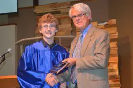 Sherman English presents the Manvel Schauffler Award to Class of '16 graduate Devin Graves.