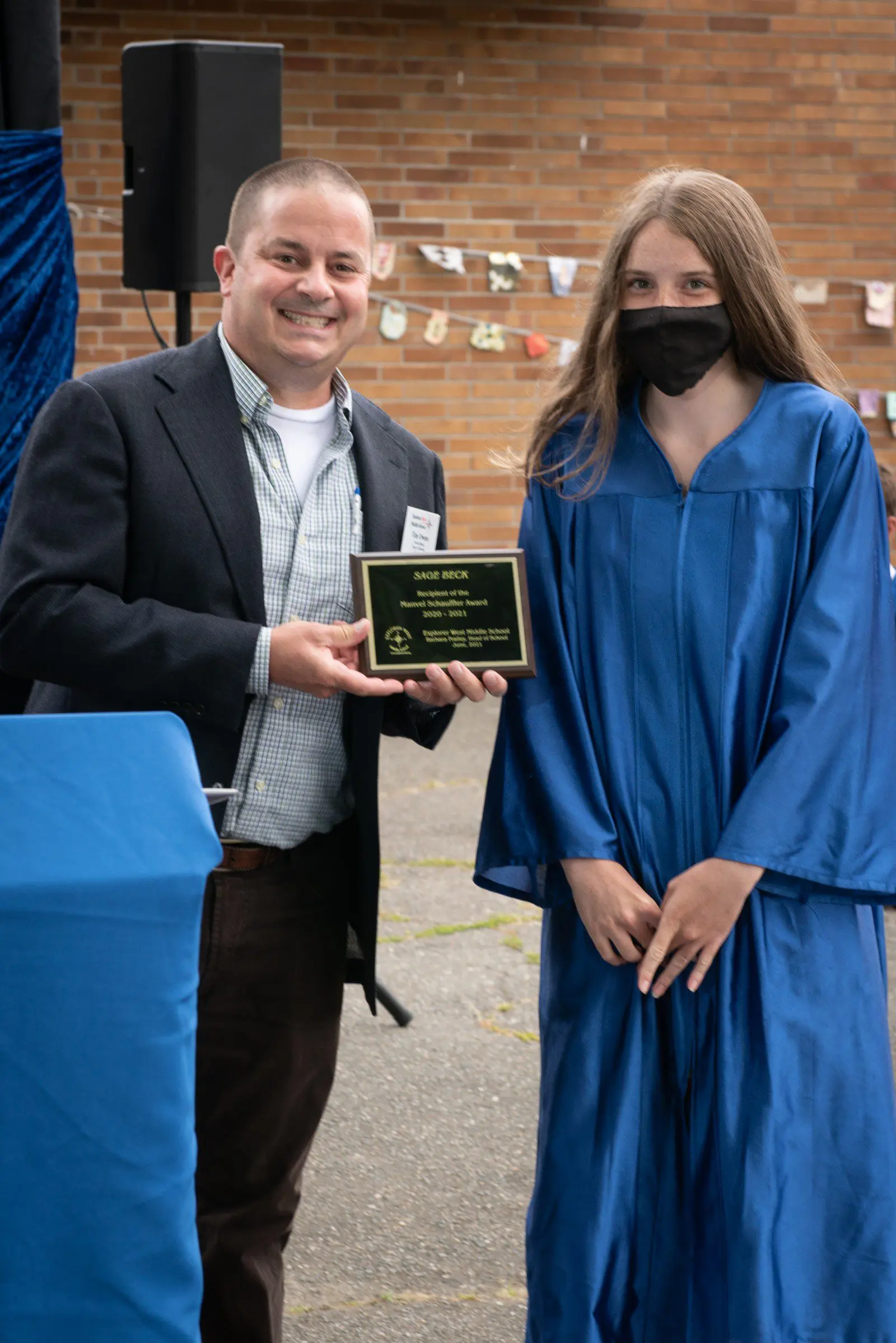 Tim Owens, Dean of Students, presents the Schauff Award