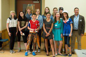 Presenting team members, current students and alumni with our Environmental Slam coach, Tim Owens.