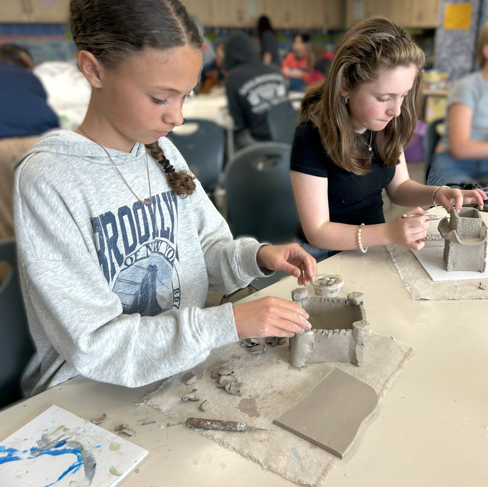 IMG_0936 copy The 6th grade ancient architecture unit has been a big hit. Brooklyn and Lilah are working on their castles.